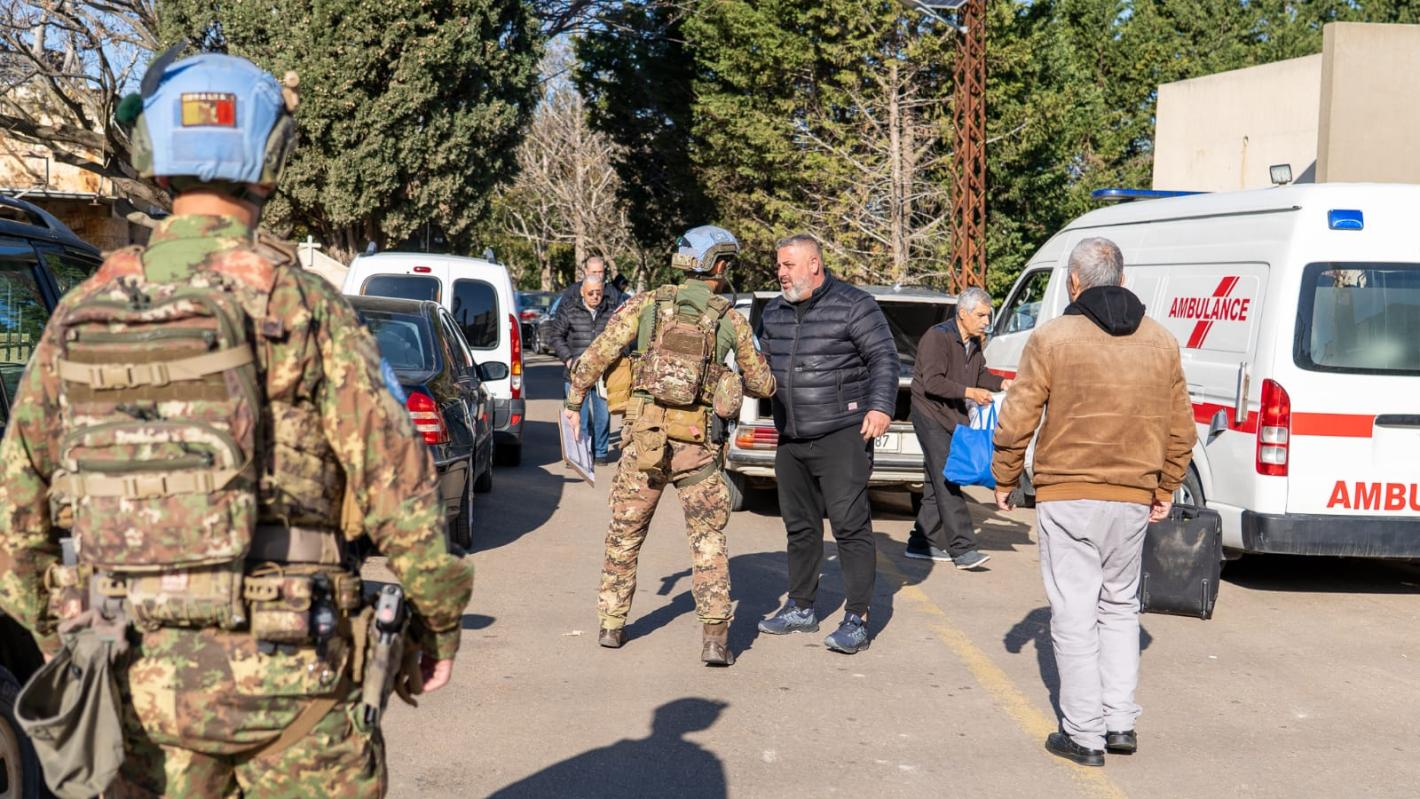 UNIFIL peacekeepers meet civilians waiting to be evacuated